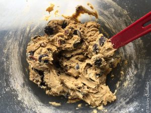 Bowl of raw cookie dough and a spatula