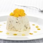 Dessert on a plate decorated with fresh orange segments