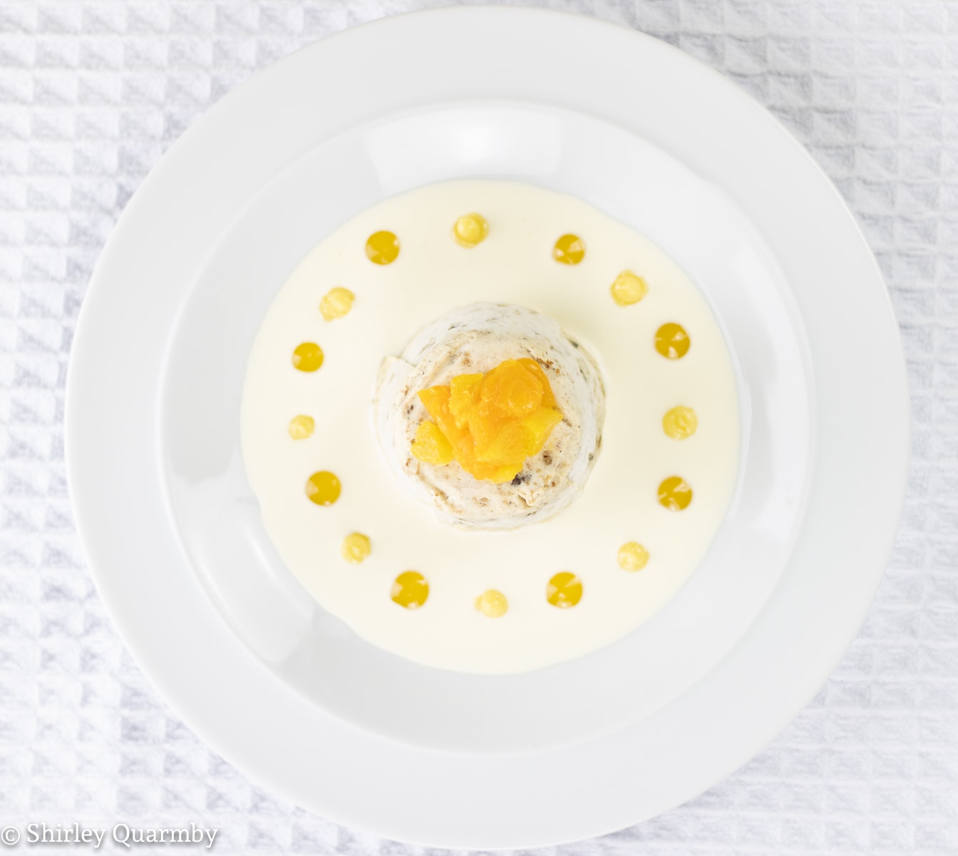 Dessert on a plate decorated with oranges