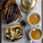 Chocolate bread with cups of coffee