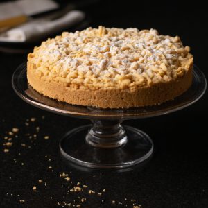 Cake on a cake stand decorated with icing sugar