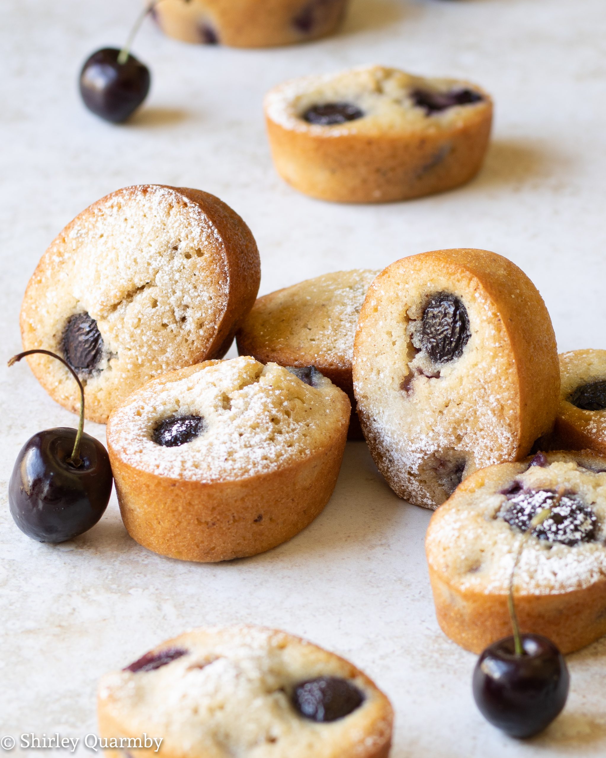 Small cakes with black cherries