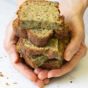 Slices of cake held in hands
